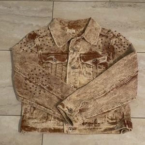 Distressed corduroy jacket with studded shoulders.